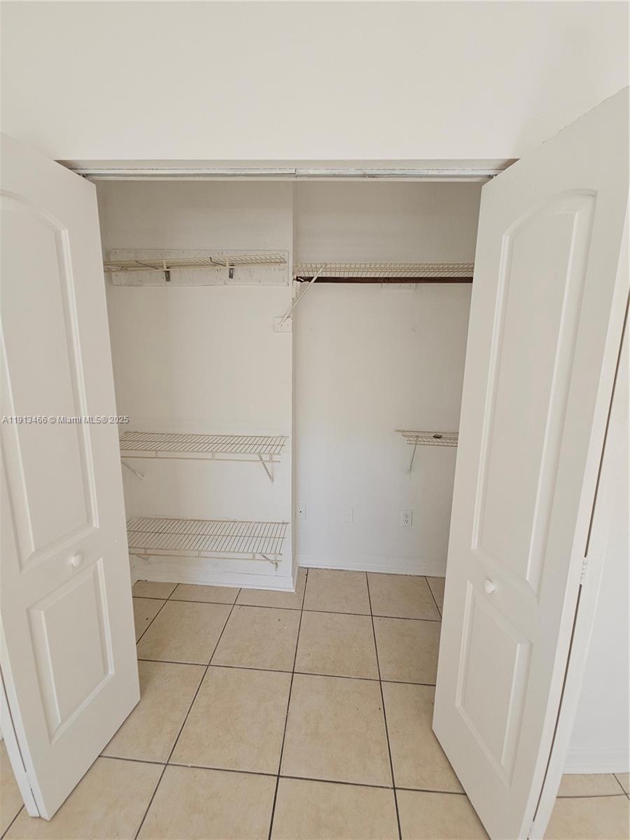 1021 Northwest 3rd Street, Unit 301 Miami, FL 33128 - Photo 6 of 9 a view of an empty walk in closet