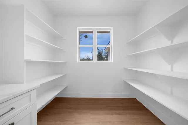 a view of an empty walk in closet