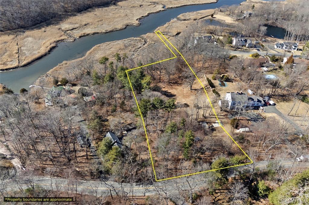 326 River Road St. James, NY 11780 - Photo 5 of 14 Aerial overview of property's location featuring property boundaries highlighted and a large body of water