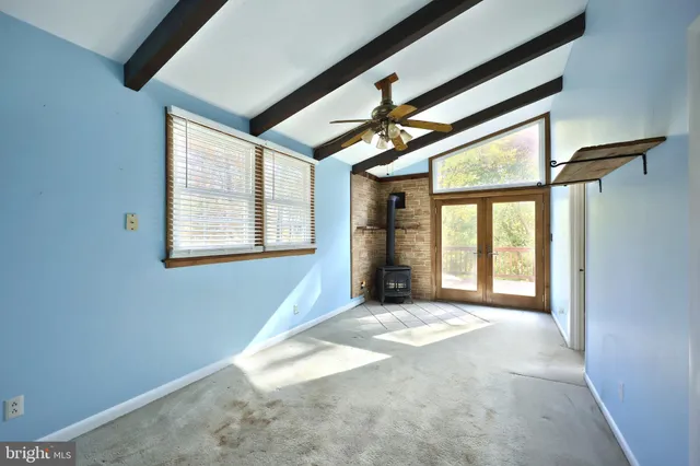 a view of balcony with wooden floor and fence