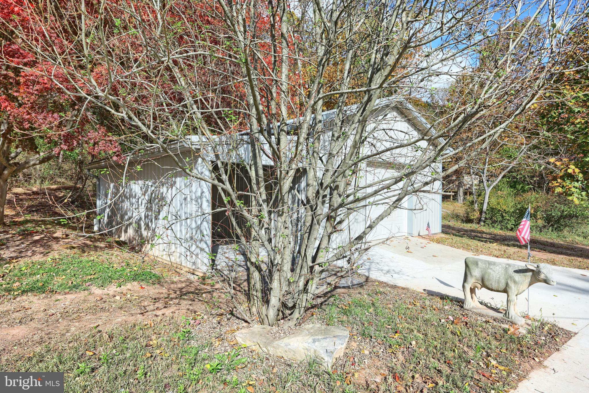 200 Slate Rock Road Biglerville, PA 17307 - Photo 33 of 43 a backyard of a house with table and chairs