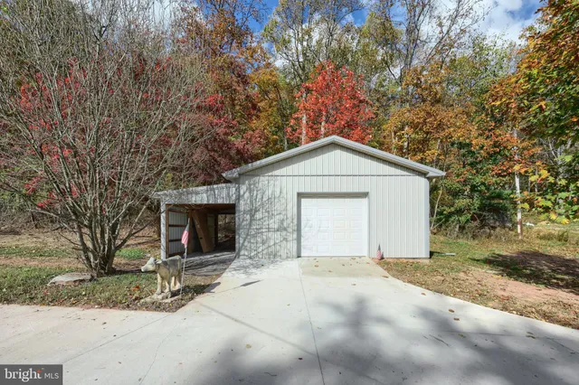 a kitchen with stainless steel appliances granite countertop a stove a sink dishwasher and a refrigerator