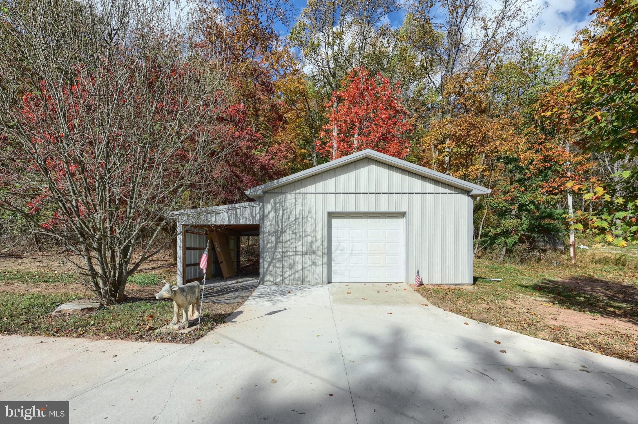 200 Slate Rock Road Biglerville, PA 17307 - Photo 4 of 43 a front view of a house with a yard and garage