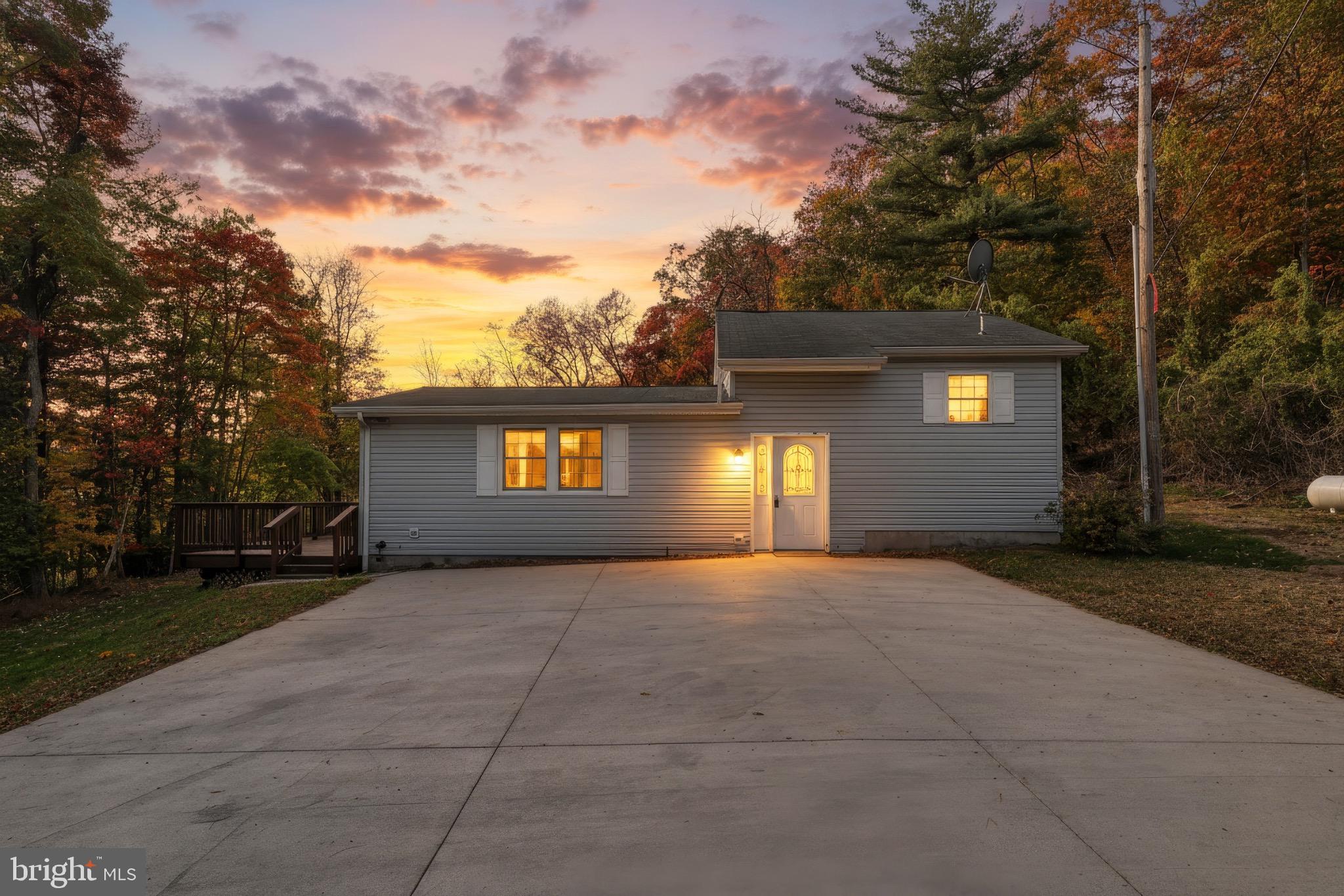 200 Slate Rock Road Biglerville, PA 17307 - Photo 5 of 43 a view of a building with a yard and a garage