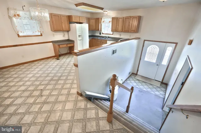 a view of a hallway with a chandelier