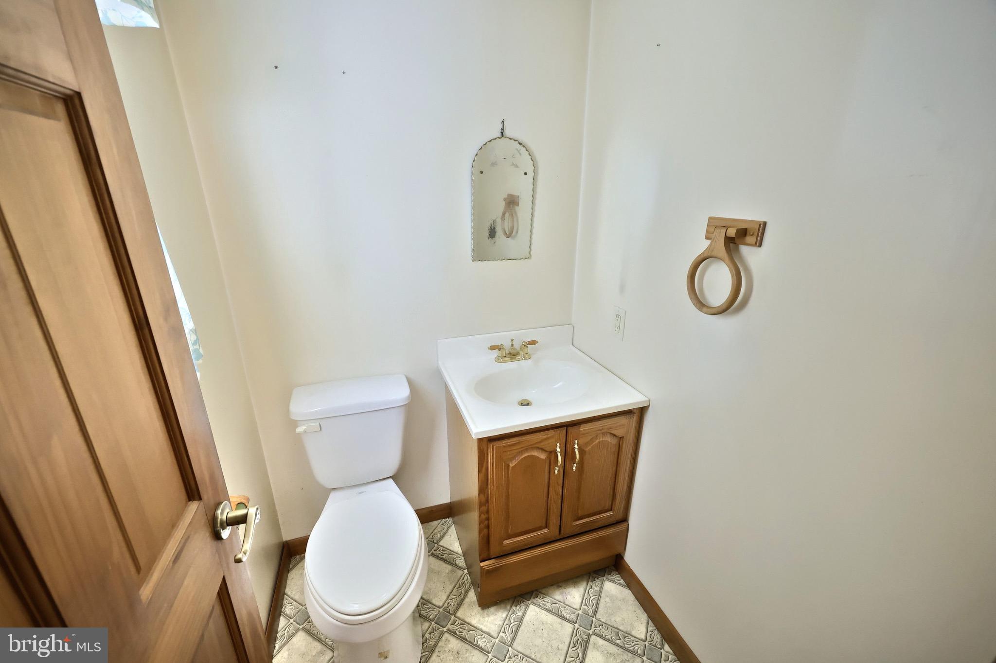 200 Slate Rock Road Biglerville, PA 17307 - Photo 10 of 43 a white toilet sitting next to a bathroom sink