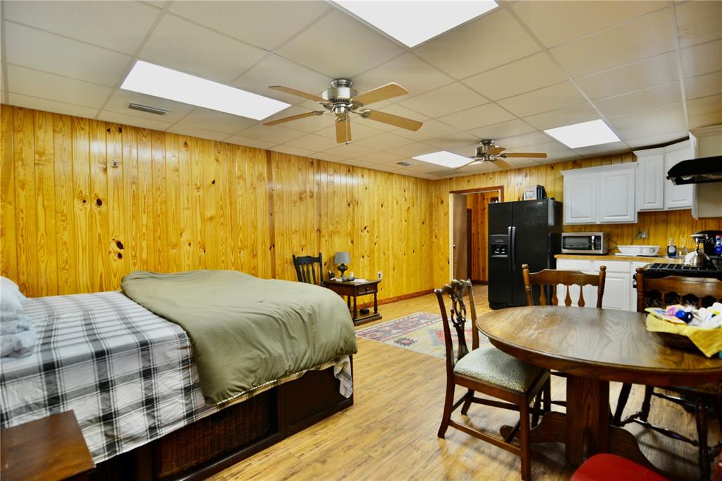 2669 Northwest Suwannee Valley Road White Springs, FL 32096 - Photo 35 of 66 a bedroom with a bed and a table in it