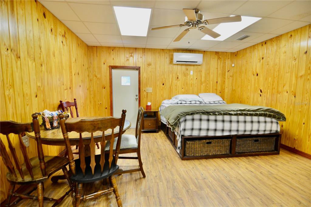 2669 Northwest Suwannee Valley Road White Springs, FL 32096 - Photo 36 of 66 a bedroom with a bed and wooden floor