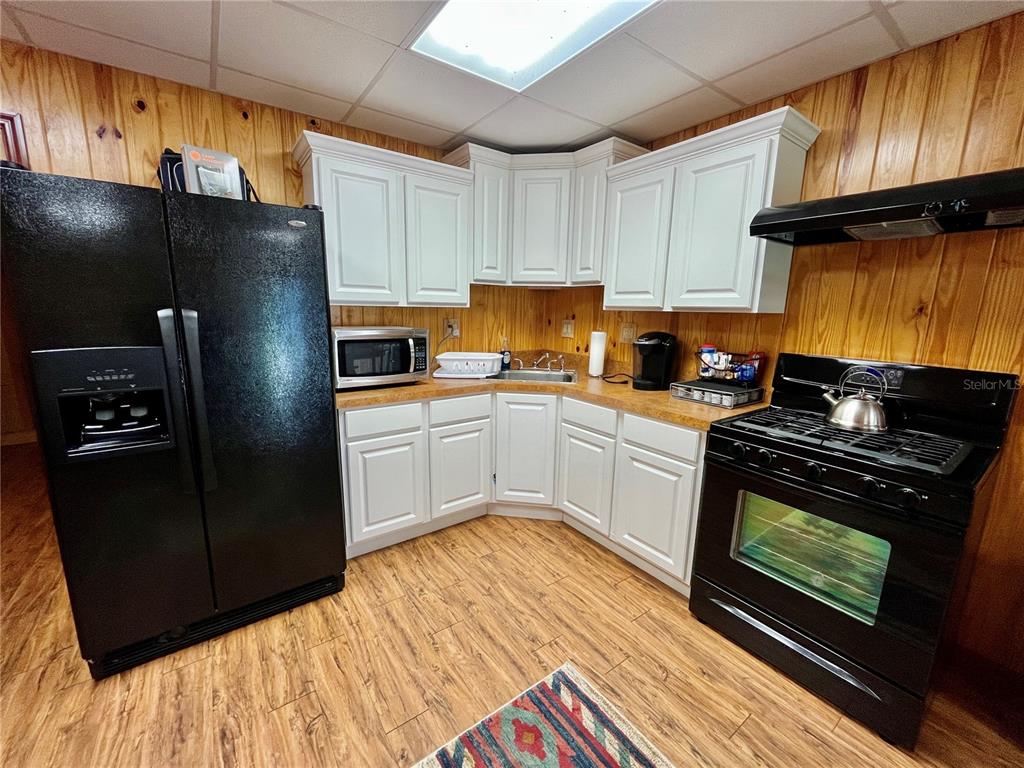 2669 Northwest Suwannee Valley Road White Springs, FL 32096 - Photo 37 of 66 a kitchen with a refrigerator stove and sink