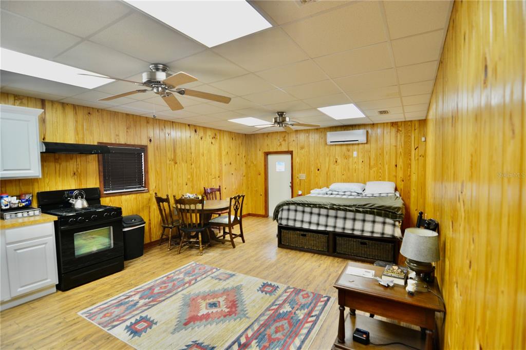 2669 Northwest Suwannee Valley Road White Springs, FL 32096 - Photo 38 of 66 a bedroom with a bed and wooden floor