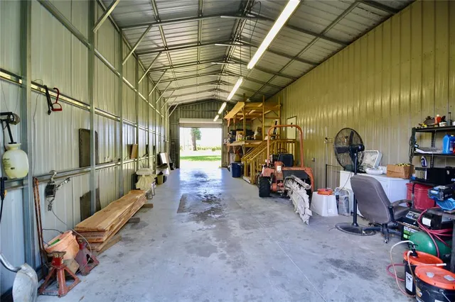 an aerial view of house with yard