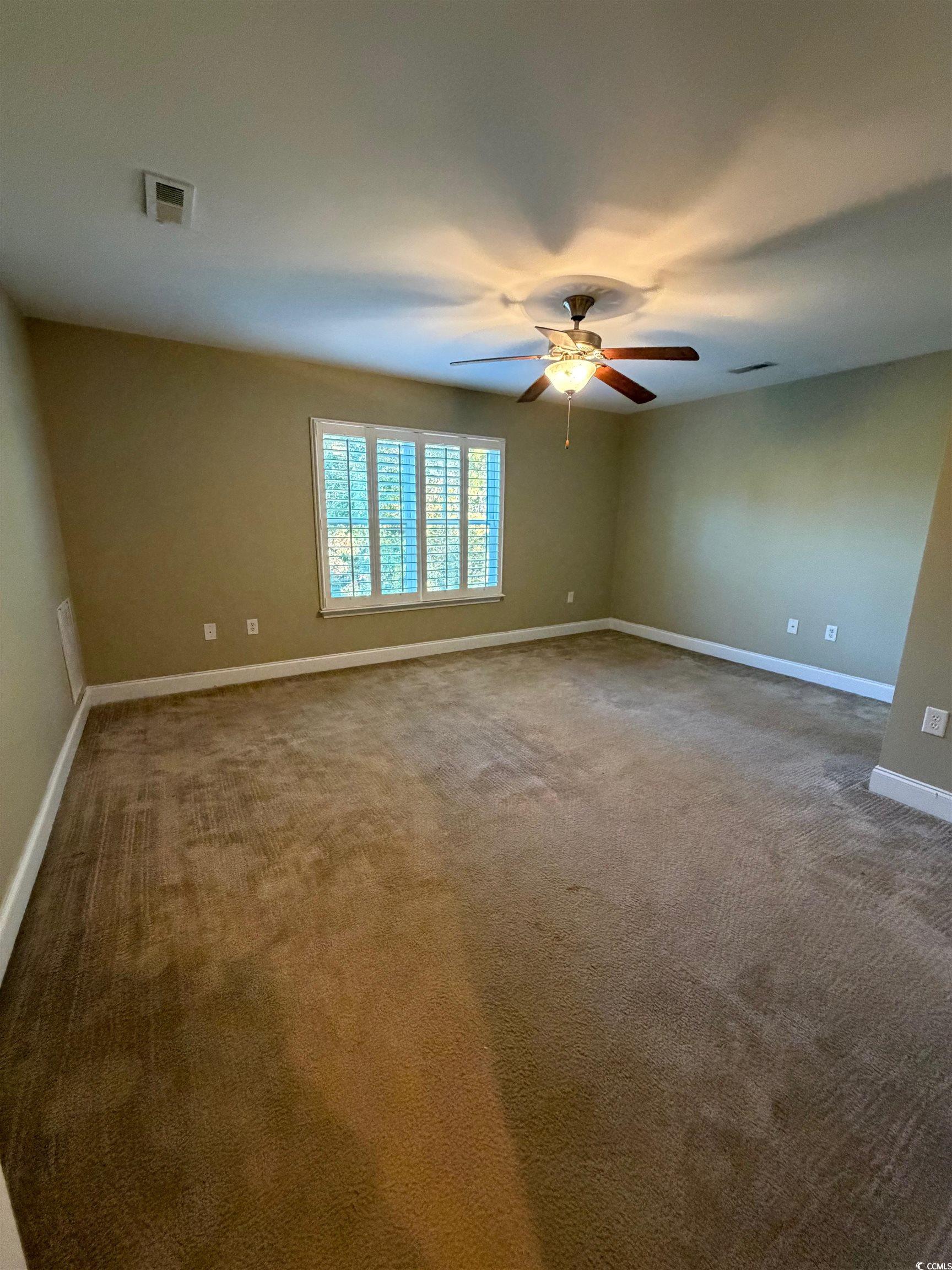 619 Uniola Drive Myrtle Beach, SC 29579 - Photo 19 of 22 Unfurnished room featuring carpet flooring and ceiling fan