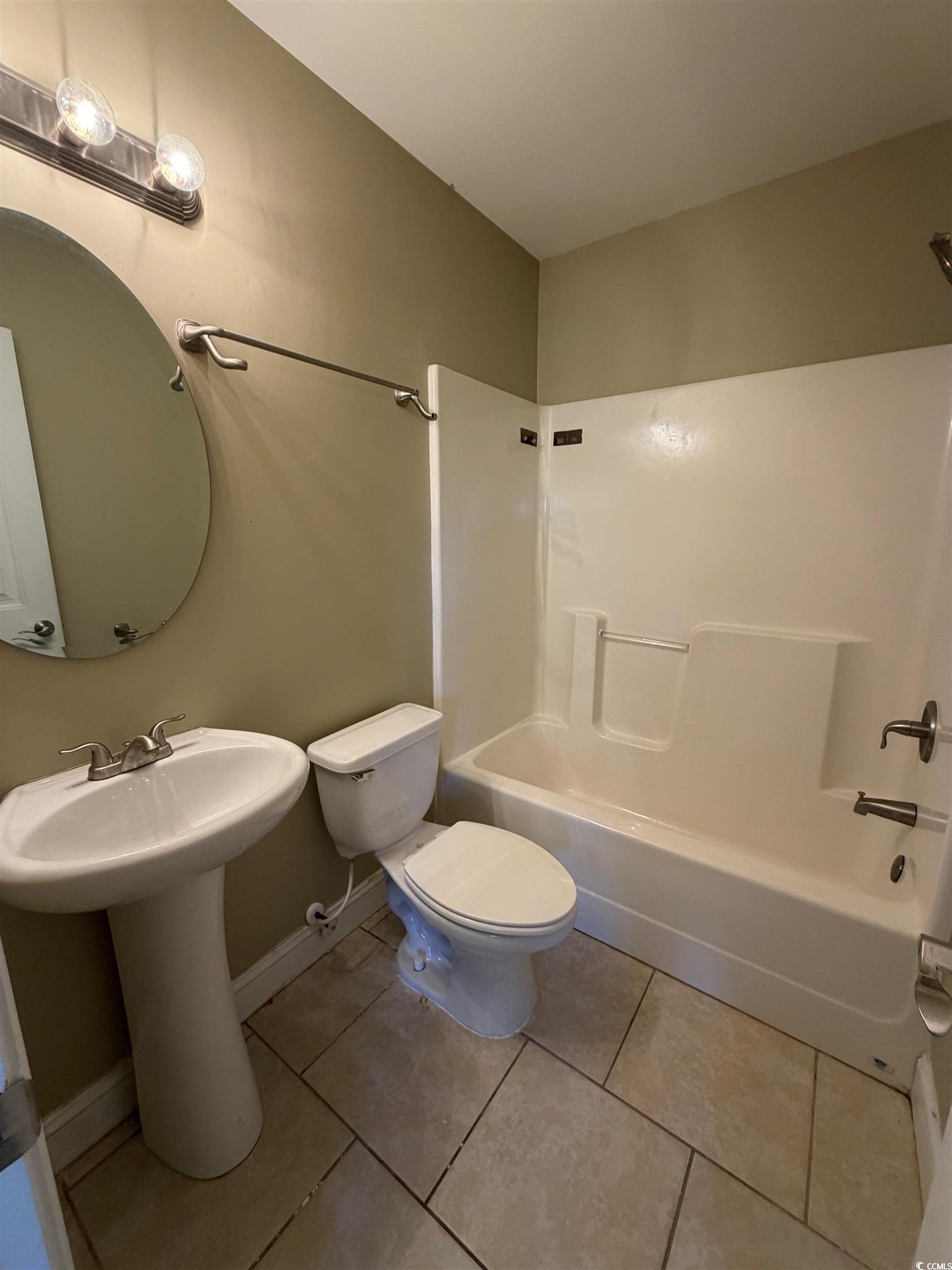 619 Uniola Drive Myrtle Beach, SC 29579 - Photo 20 of 22 Bathroom with light tile patterned flooring and washtub / shower combination