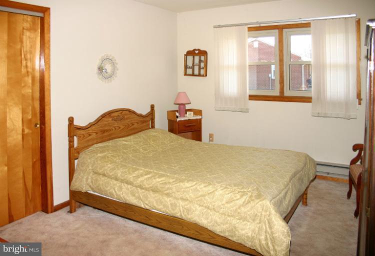 3570 Water Tank Road Manchester, MD 21102 - Photo 3 of 18 a bedroom with a bed and a window