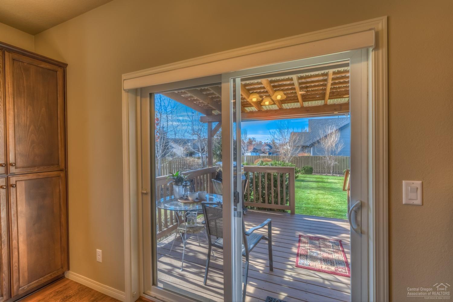 2905 Southwest 49th Street Redmond, OR 97756 - Photo 4 of 24 Slider to the covered deck and backyard