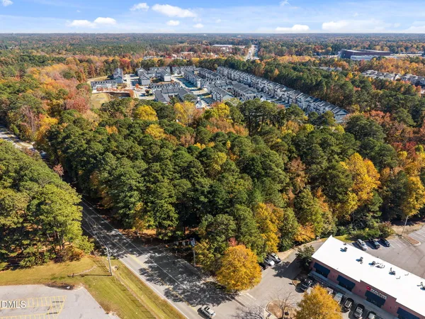 an aerial view of a residential houses with outdoor space