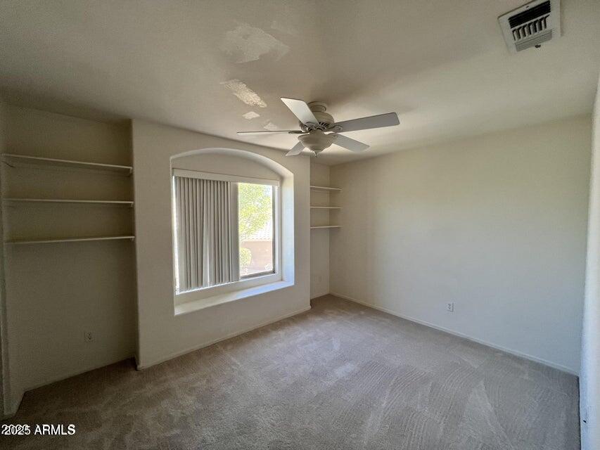 2720 South Los Altos Place Chandler, AZ 85286 - Photo 14 of 20 an empty room with windows and fan