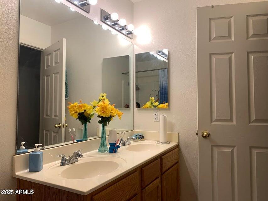 2720 South Los Altos Place Chandler, AZ 85286 - Photo 16 of 20 a bathroom with a sink double vanity and a mirror