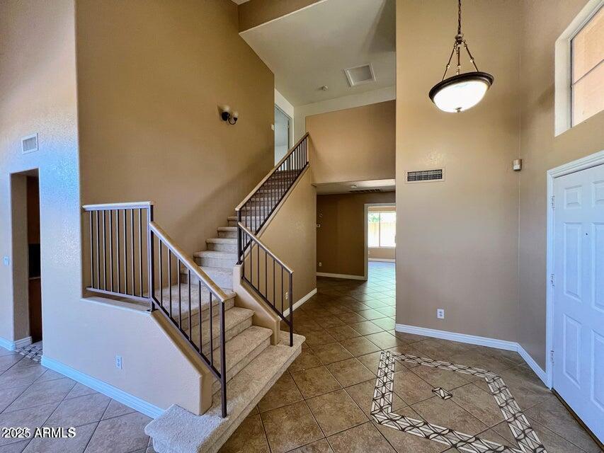 2720 South Los Altos Place Chandler, AZ 85286 - Photo 9 of 20 a view of entryway with stairs and wooden floor