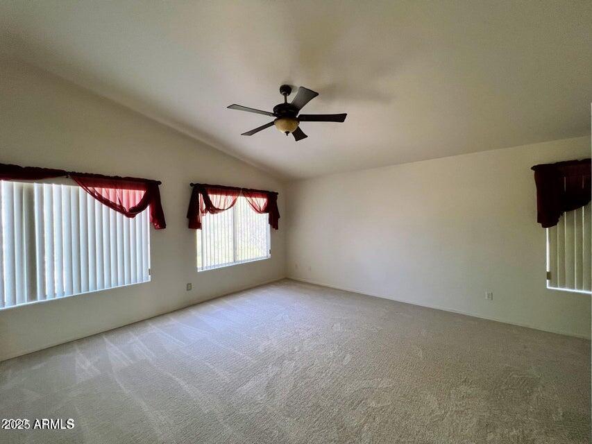2720 South Los Altos Place Chandler, AZ 85286 - Photo 10 of 20 an empty room with windows and ceiling fan