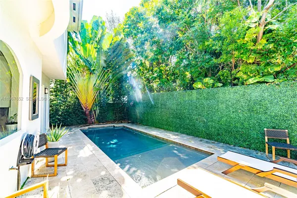 a view of a swimming pool with a patio
