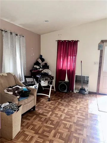 a living room with furniture a piano and a fireplace