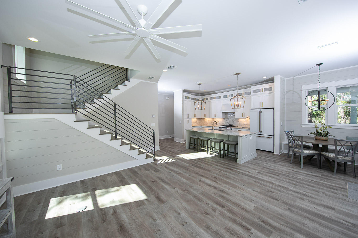 40 Kristin Court Santa Rosa Beach, FL 32459 - Photo 13 of 87 a kitchen with stainless steel appliances wooden floor dining table and chairs