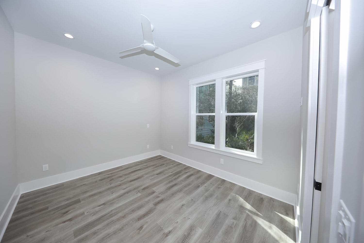 40 Kristin Court Santa Rosa Beach, FL 32459 - Photo 23 of 87 an empty room with wooden floor and windows