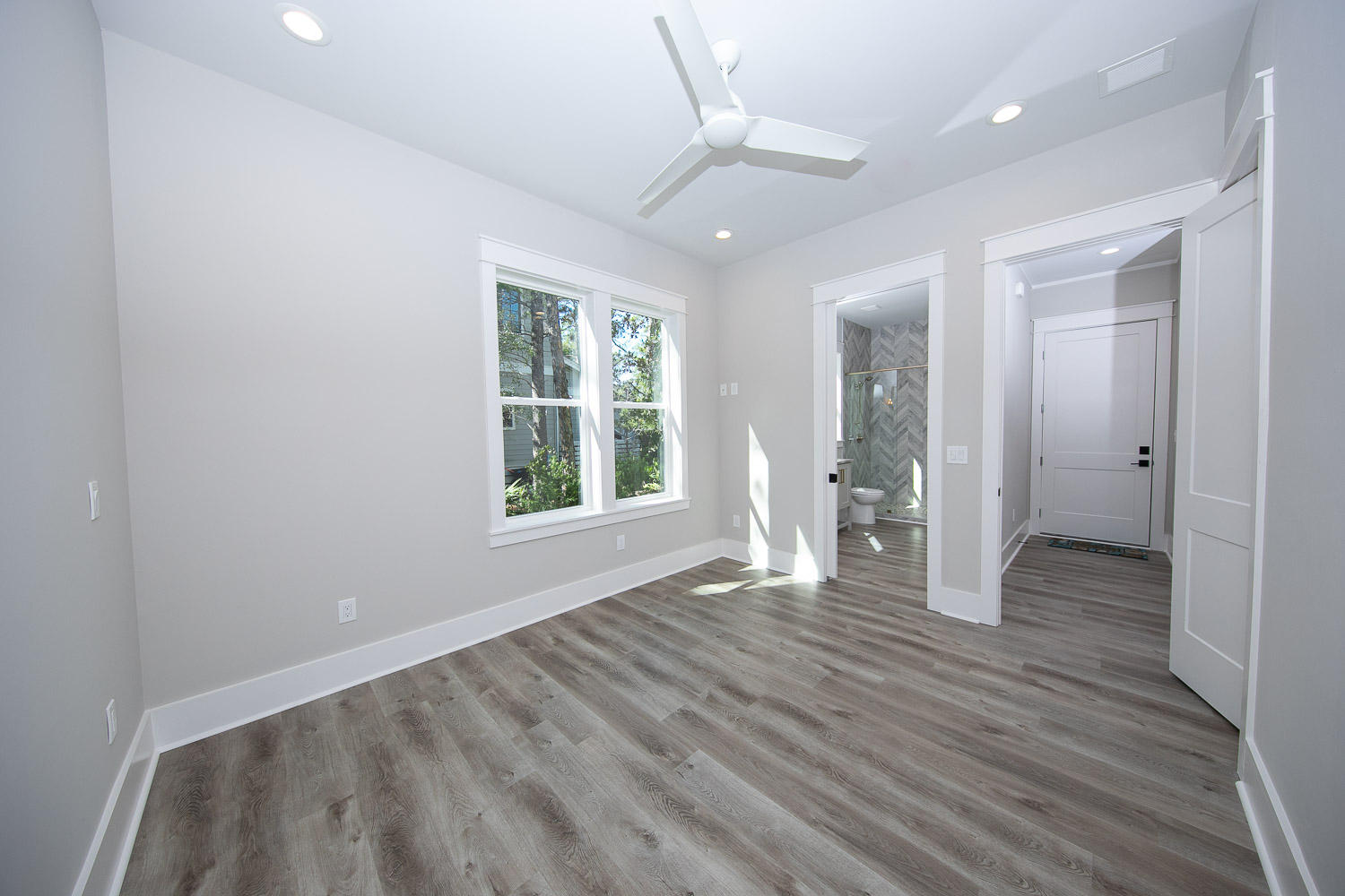 40 Kristin Court Santa Rosa Beach, FL 32459 - Photo 24 of 87 a view of an empty room with wooden floor and a window