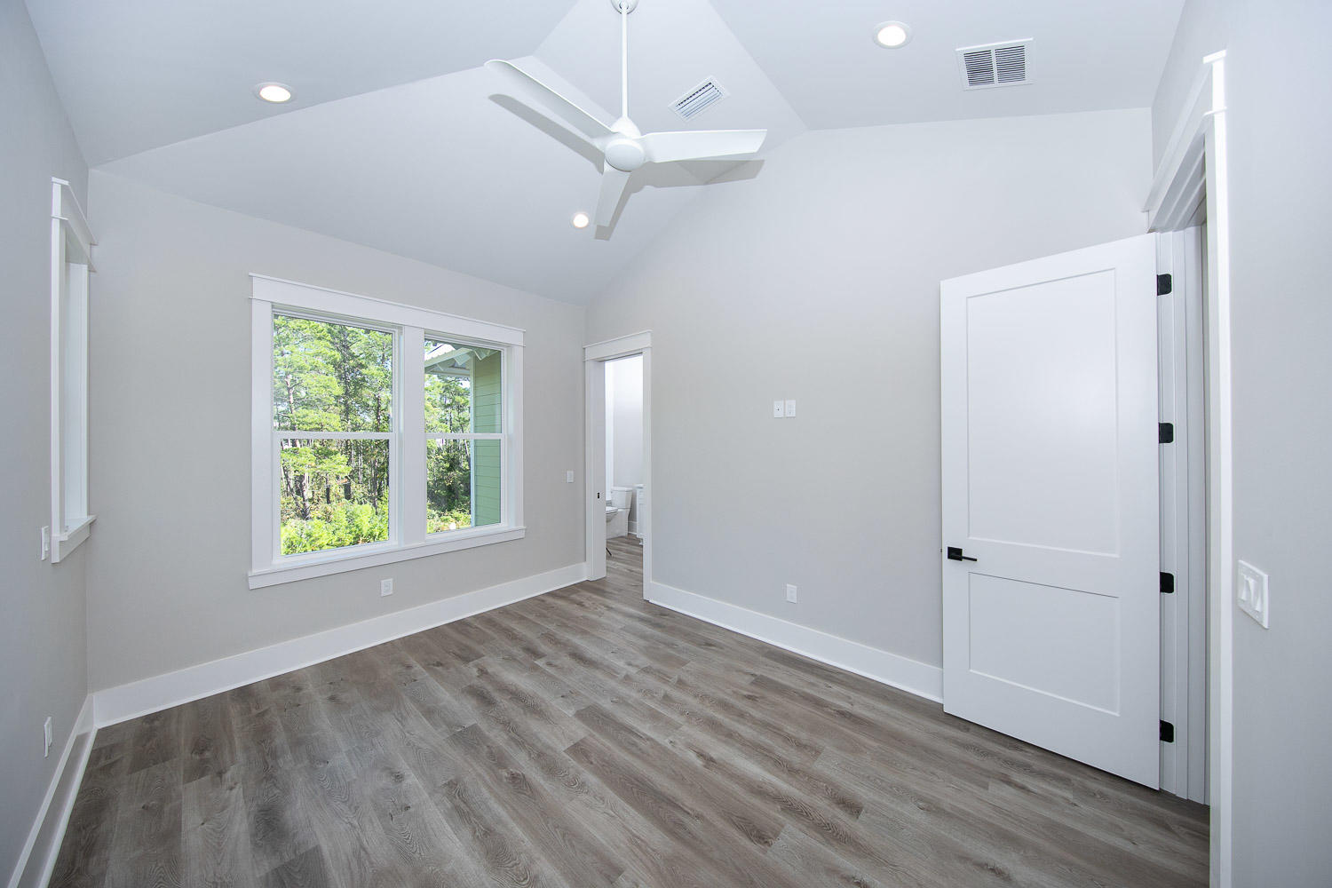 40 Kristin Court Santa Rosa Beach, FL 32459 - Photo 45 of 87 a view of an empty room with wooden floor and a window
