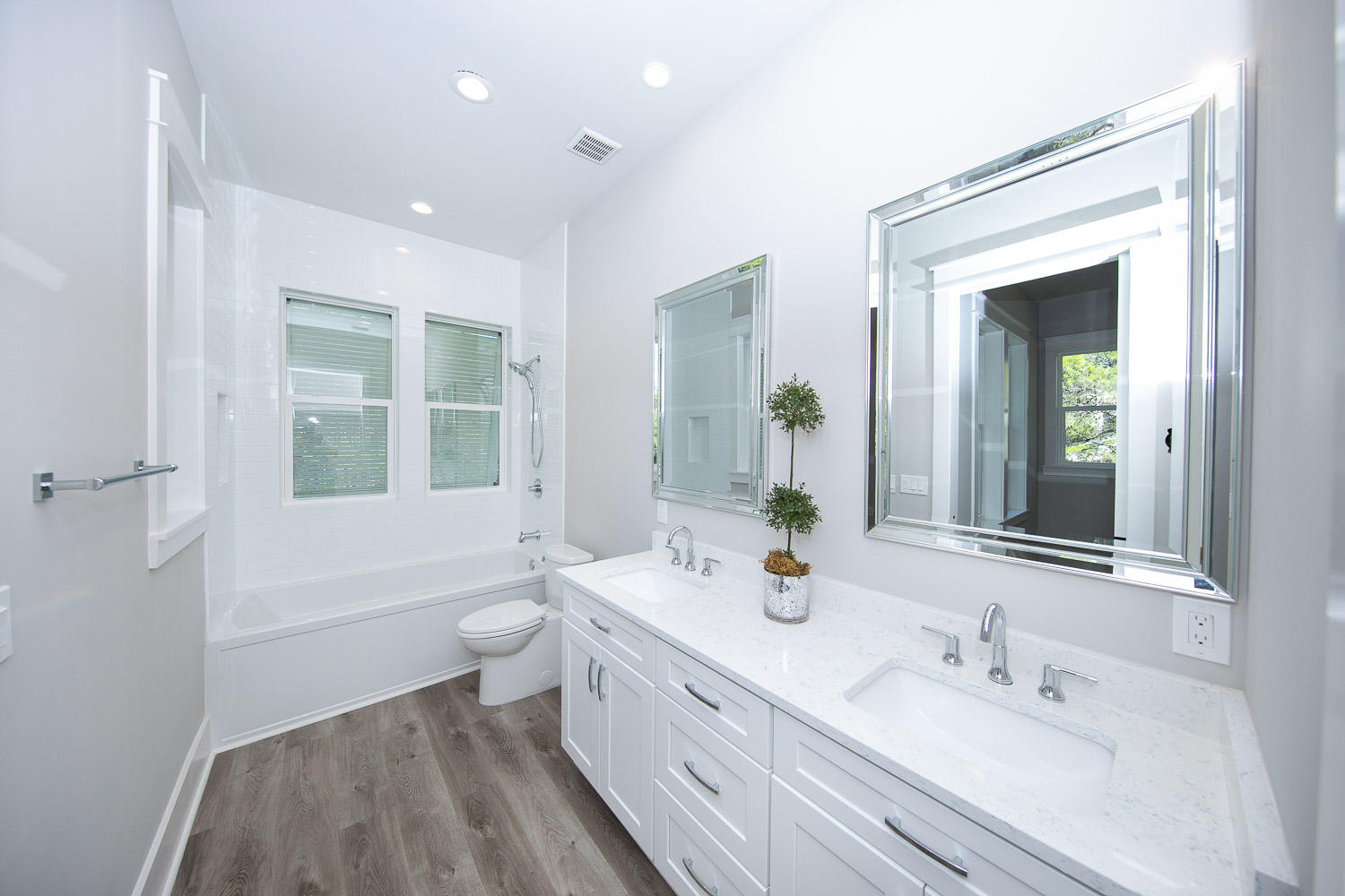 40 Kristin Court Santa Rosa Beach, FL 32459 - Photo 47 of 87 a bathroom with a double vanity sink a toilet and a large mirror