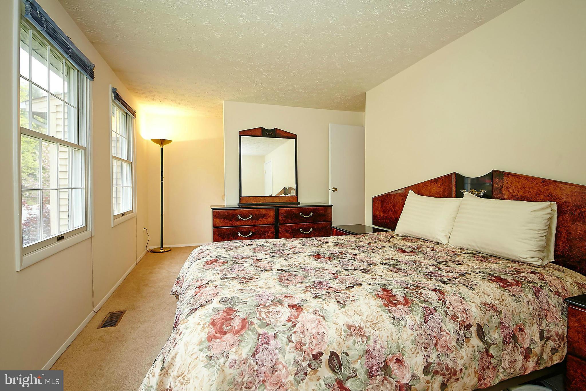 6256 Hillside Road Springfield, VA 22152 - Photo 14 of 30 a bedroom with a large bed and a window
