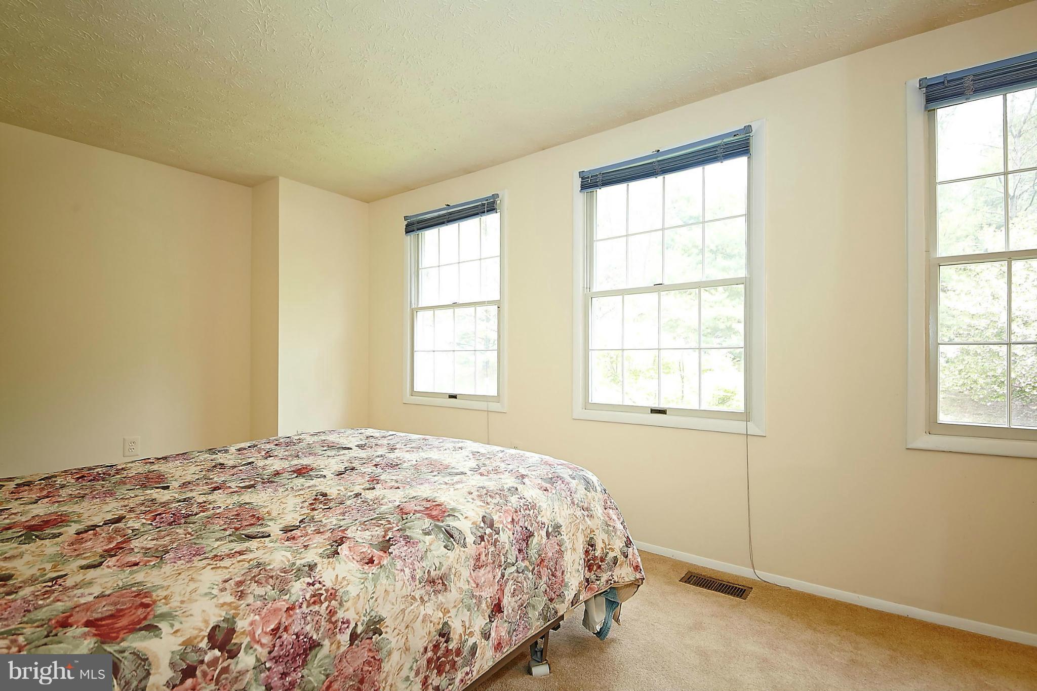 6256 Hillside Road Springfield, VA 22152 - Photo 15 of 30 a bedroom with a bed and a window