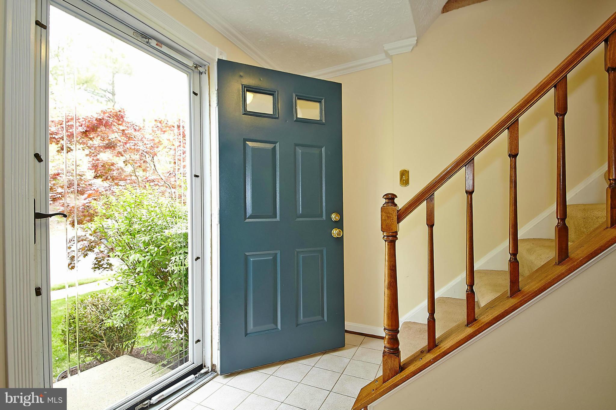 6256 Hillside Road Springfield, VA 22152 - Photo 3 of 30 a view of staircase with lots of green walls