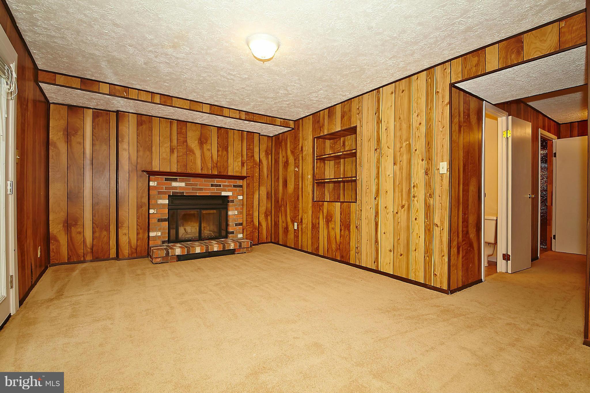 6256 Hillside Road Springfield, VA 22152 - Photo 23 of 30 a view of an empty room with a fireplace