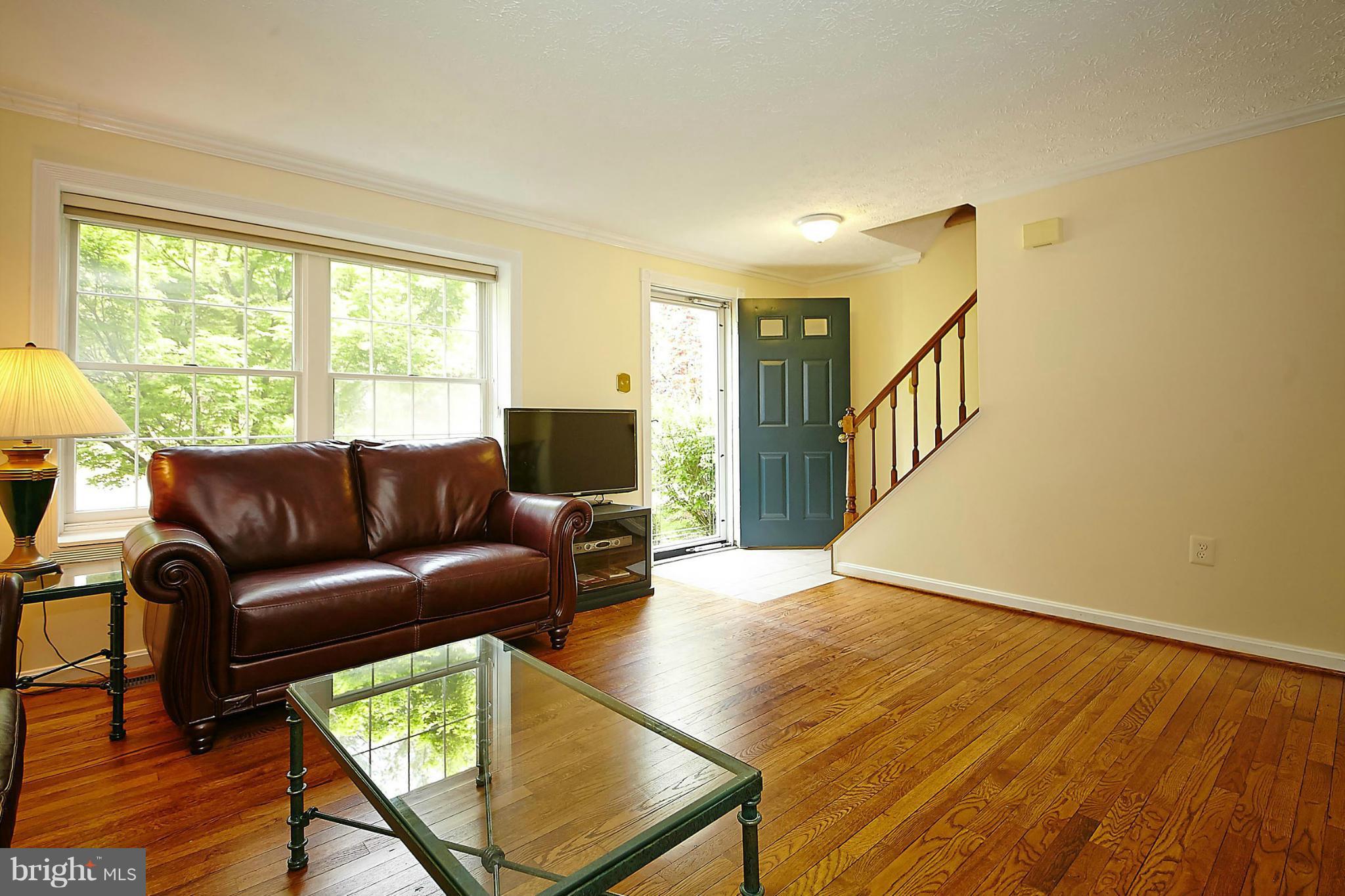 6256 Hillside Road Springfield, VA 22152 - Photo 4 of 30 a living room with furniture and a flat screen tv