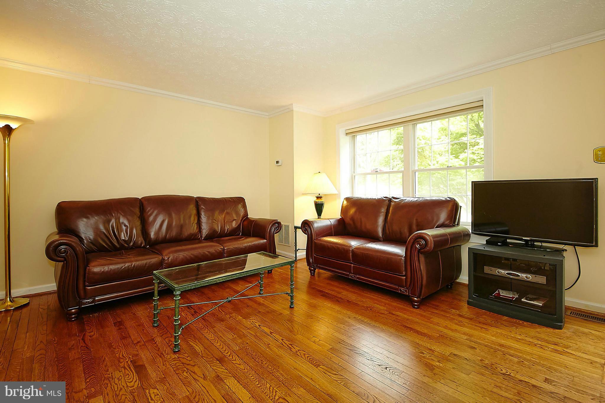 6256 Hillside Road Springfield, VA 22152 - Photo 5 of 30 a living room with furniture and a flat screen tv
