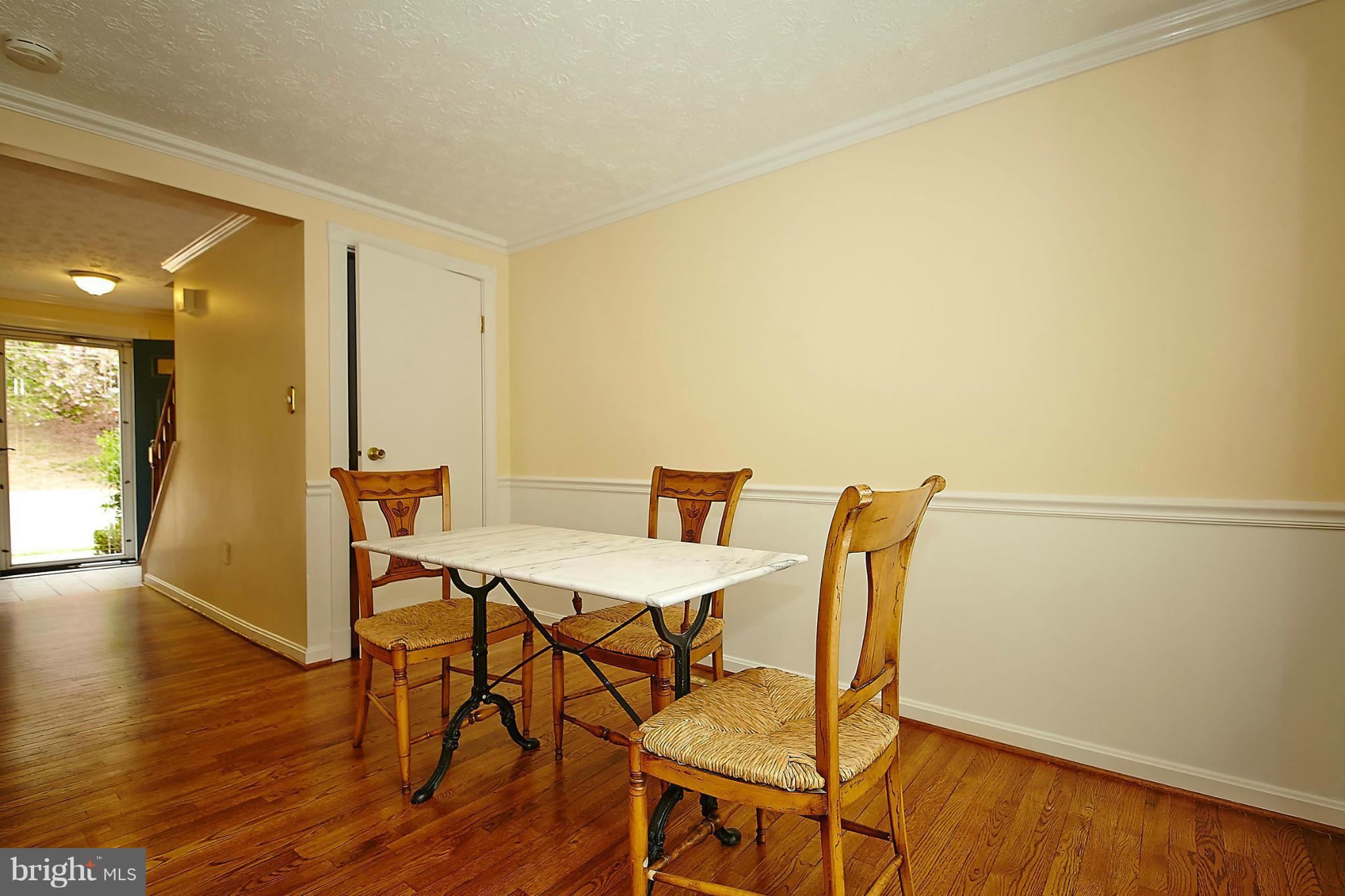 6256 Hillside Road Springfield, VA 22152 - Photo 7 of 30 a view of a dining room with furniture and wooden floor
