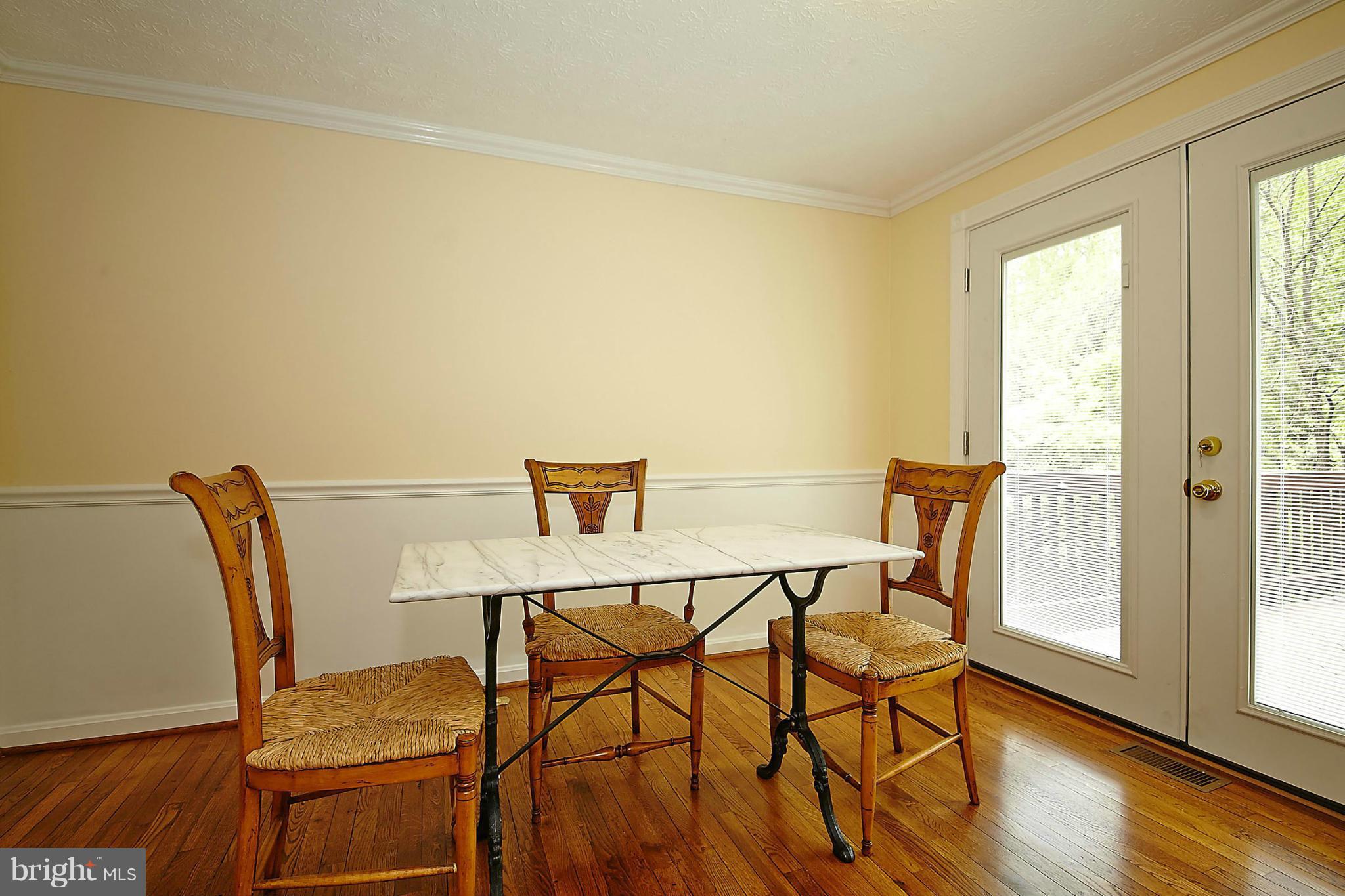 6256 Hillside Road Springfield, VA 22152 - Photo 8 of 30 a view of a dining room with furniture and wooden floor