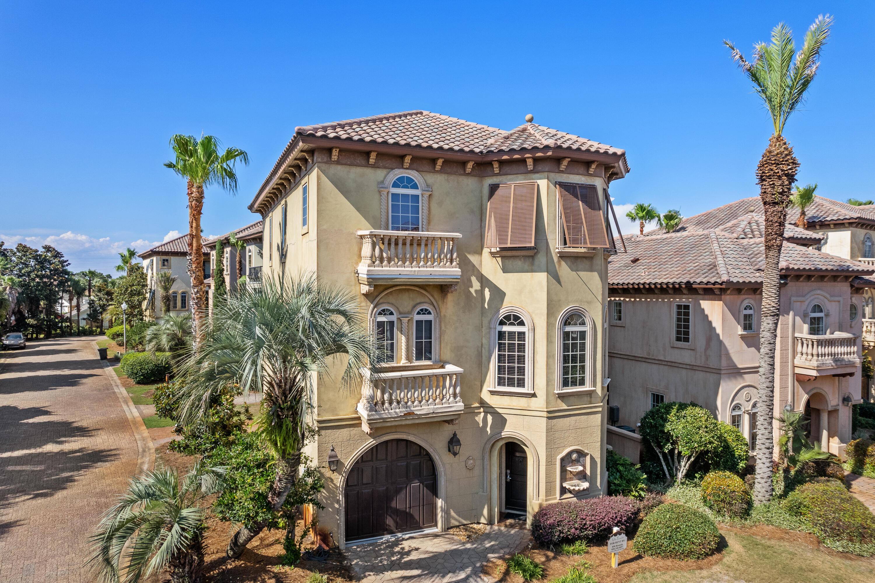 58 Rue St Tropez Miramar Beach, FL 32550 - Photo 1 of 59 a front view of a house with a garden
