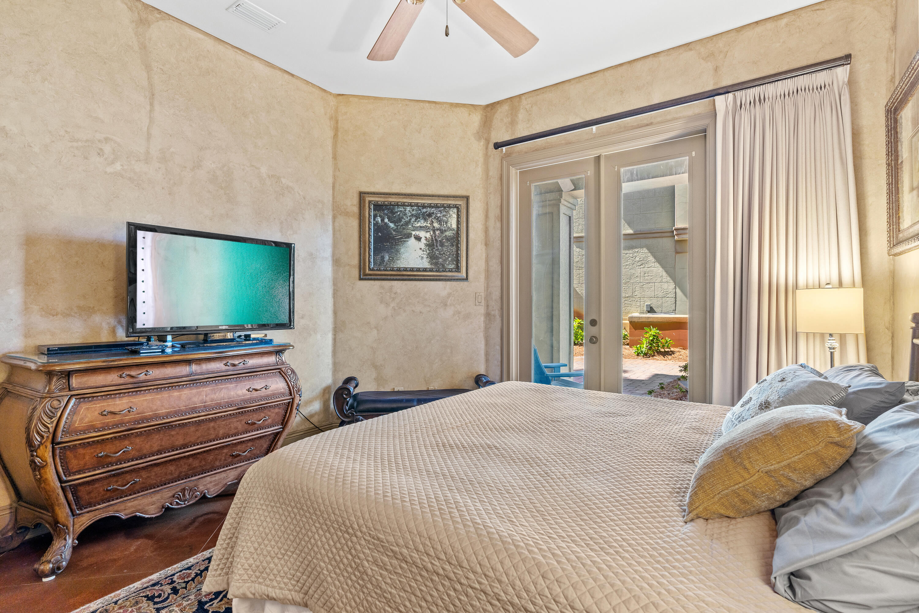 58 Rue St Tropez Miramar Beach, FL 32550 - Photo 10 of 59 a bedroom with a bed and a flat screen tv