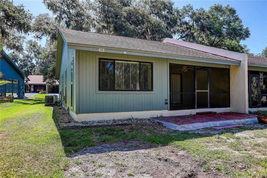 6643 Trail Ridge Drive Lakeland, FL 33813 - Photo 34 of 36 a view of a house with a yard