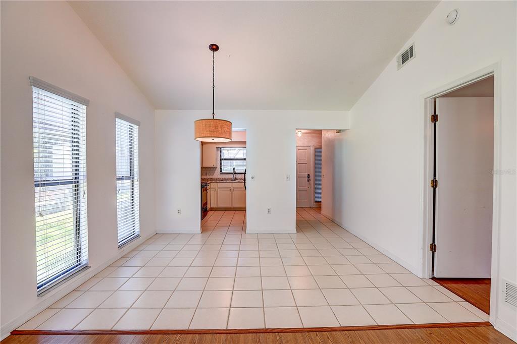 6643 Trail Ridge Drive Lakeland, FL 33813 - Photo 8 of 36 a view of empty room with windows and refrigerator