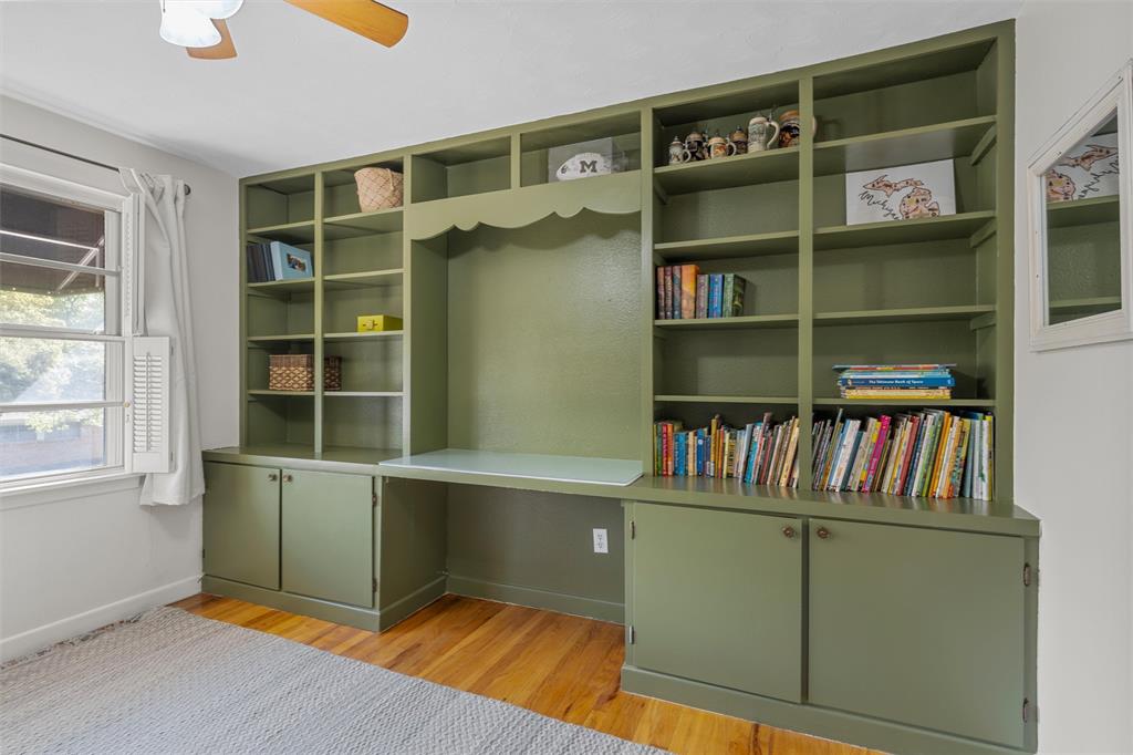 2216 Hermanson Drive Waco, TX 76710 - Photo 20 of 39 a room with furniture and a book shelf