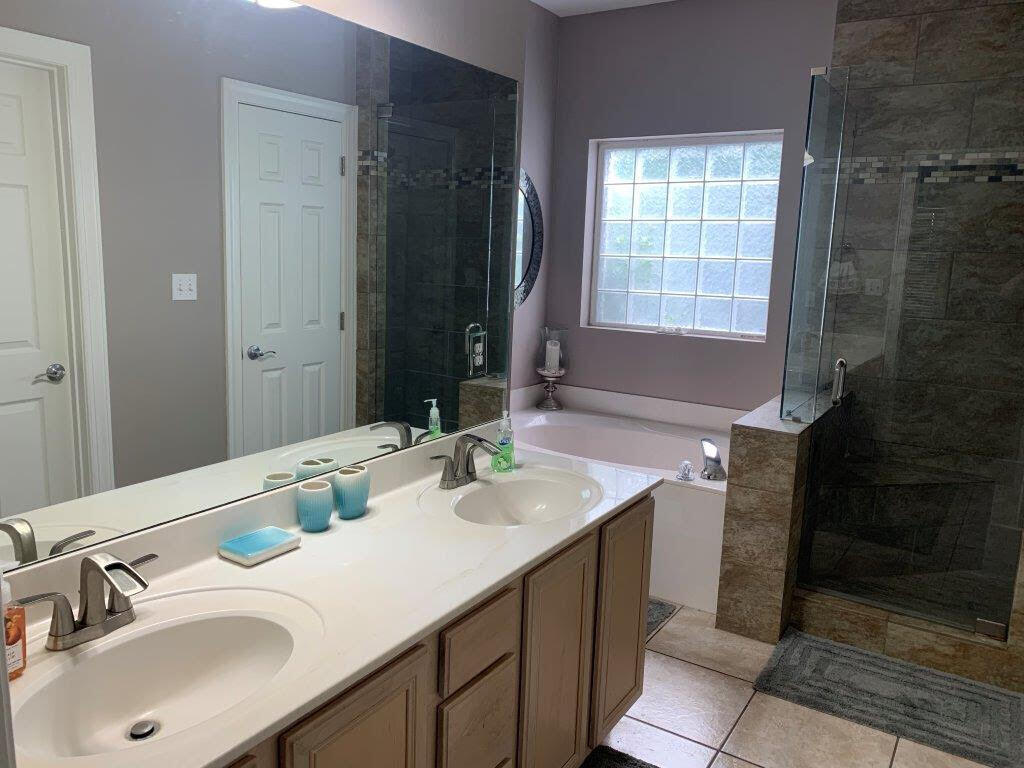 54 Batchelors Button Drive, Unit 9 Miramar Beach, FL 32550 - Photo 12 of 28 a bathroom with a sink and a mirror