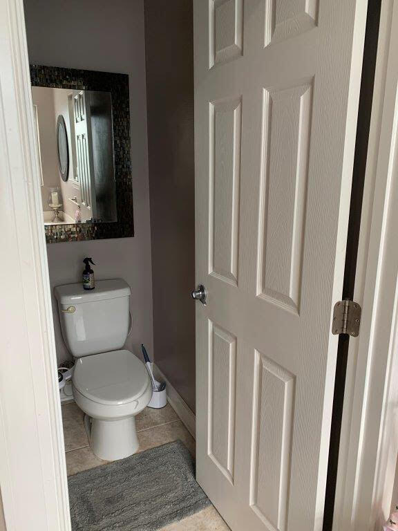 54 Batchelors Button Drive, Unit 9 Miramar Beach, FL 32550 - Photo 13 of 28 a bathroom with a toilet a sink and a mirror