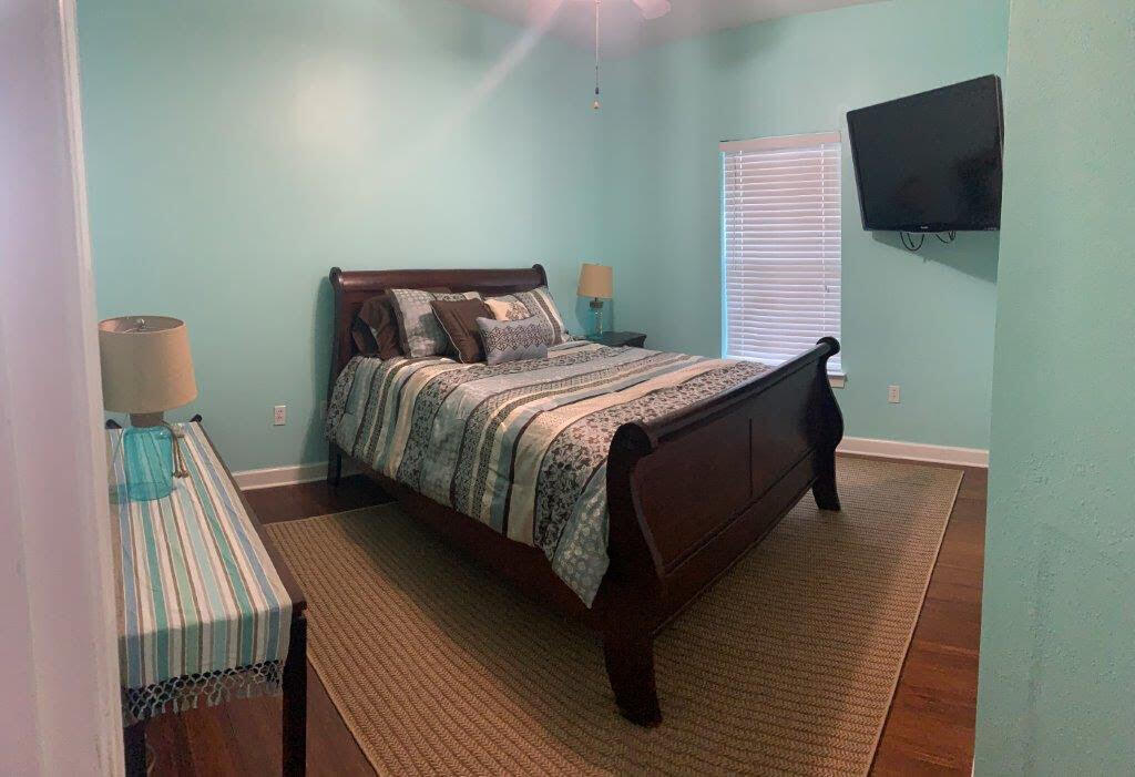 54 Batchelors Button Drive, Unit 9 Miramar Beach, FL 32550 - Photo 16 of 28 a bed sitting in a bedroom next to a tv