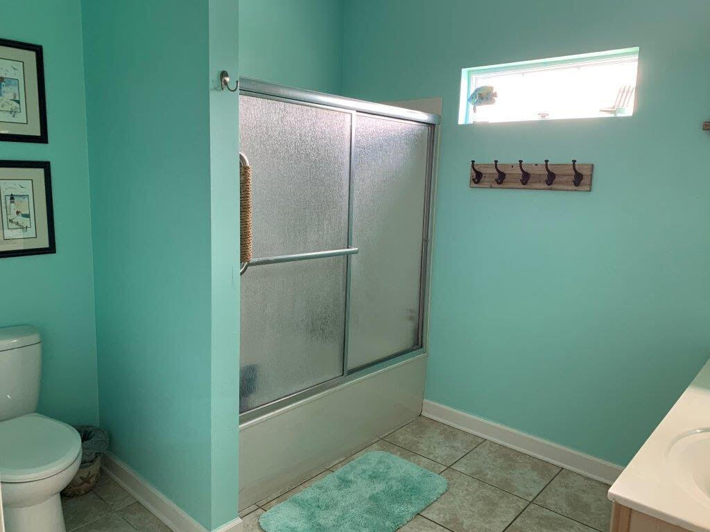 54 Batchelors Button Drive, Unit 9 Miramar Beach, FL 32550 - Photo 17 of 28 a bathroom with a glass shower door
