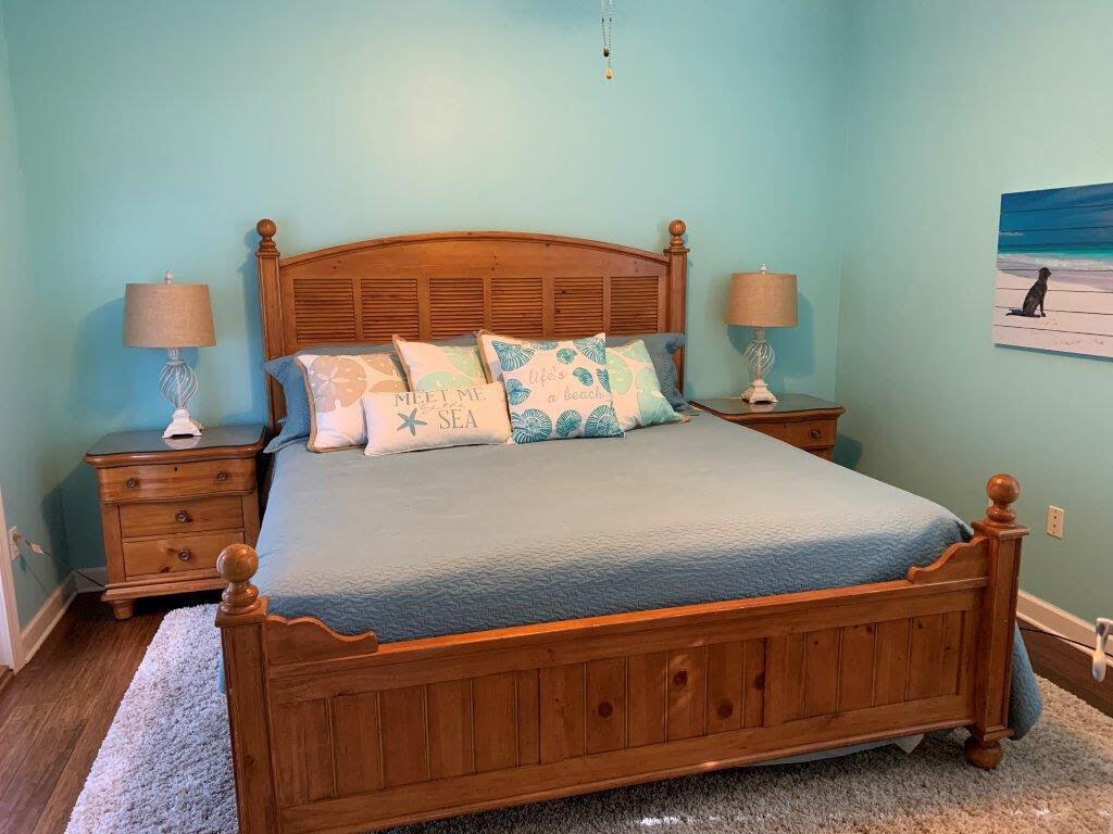 54 Batchelors Button Drive, Unit 9 Miramar Beach, FL 32550 - Photo 19 of 28 a bedroom with a bed and dresser
