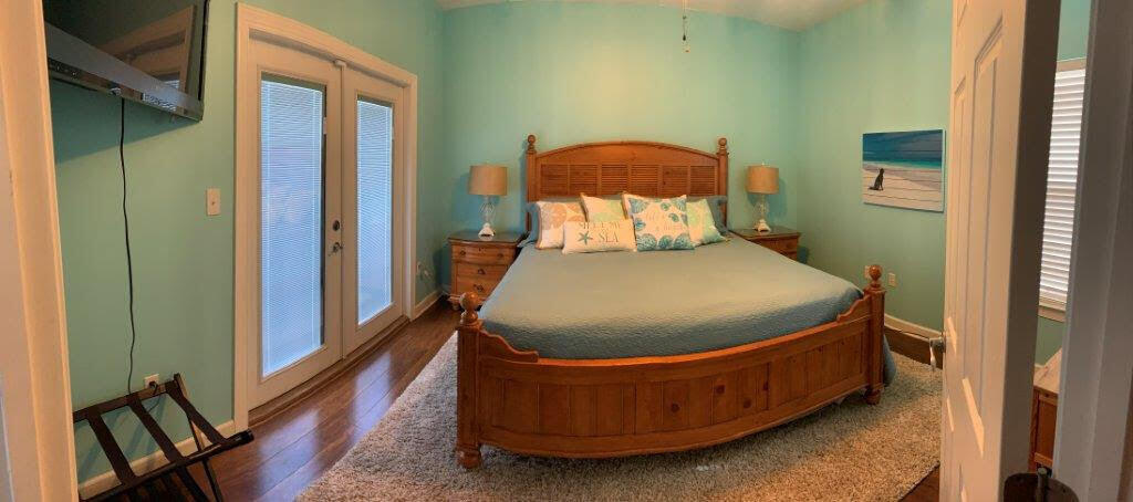 54 Batchelors Button Drive, Unit 9 Miramar Beach, FL 32550 - Photo 20 of 28 a bed sitting in a bedroom next to a window